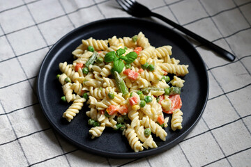 Pasta Salad with vegetables with sauce and spices.