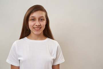 Partial of smiling teenage girl looking at camera