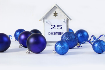 Calendar for December 25: a decorative house with the name December in English, the numbers 25...