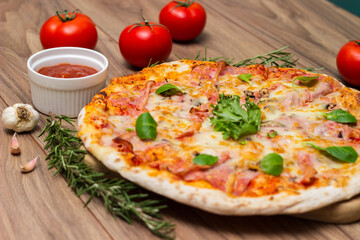 Italian pizza Capricciosa  with cheese, tomato sauce and basil