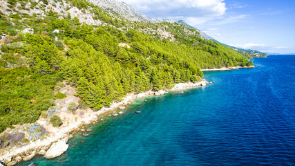 Makarska. Tourist city of Makarska aerial view of beaches and Biokovo mountain, Dalmatia archipelago of Croatia