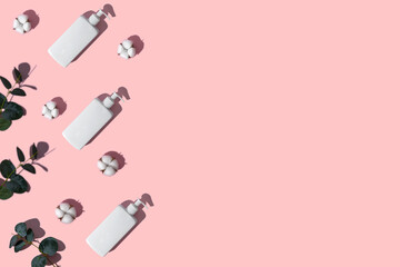 White dispenser cream branch of eucalyptus white cotton flowers.