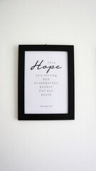 A photo of a frame that reads a bible verse in Hebrew 6:19 about this hope is a strong and trustworthy anchor for our soul.