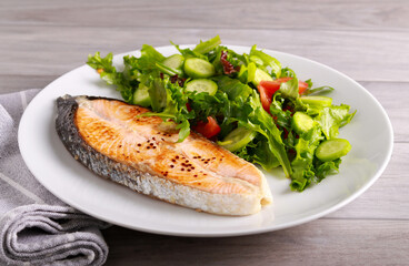 salmon steak with salad