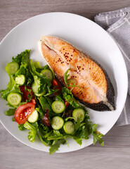 salmon steak with salad