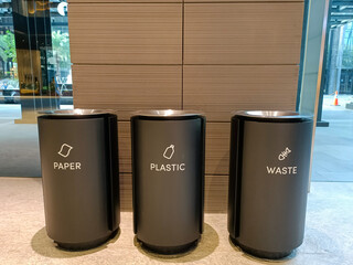 Elegant three type of trash bin in the office line up. - obrazy, fototapety, plakaty