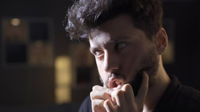 The young man is mentally ill. Paranoia or schizophrenia and insanity.
The schizophrenic man is alone in the house and is making strange movements and is going crazy and out of his mind.
