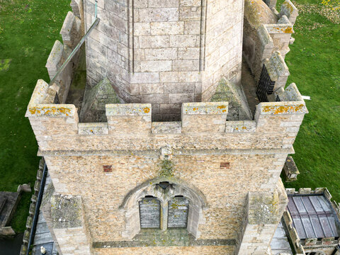 Drone aerial view of a typical English church showing the ornate features and leaded roof.