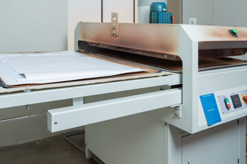 Garment printing machine in a workshop
