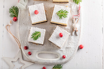 Fototapeta na wymiar Traditionally Poppy seed cheesecake for Christmas with poppy and cheese.
