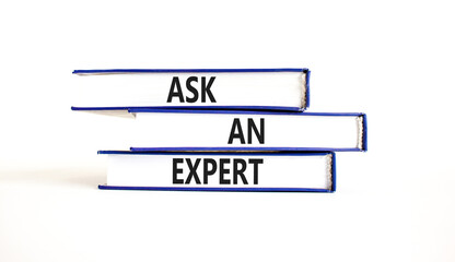 Ask an expert symbol. Concept words Ask an expert on books on a beautiful white table white background. Business and ask an expert concept. Copy space.