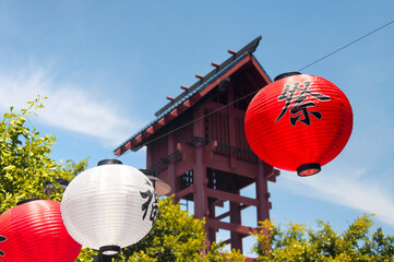 red and white lanterns hanging in Los Angeles California Japan Town.  Fu and Cha characters mean tea and good luck.