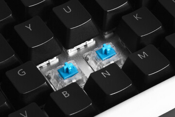 Macro photo of blue mechanical keyboard switches all together