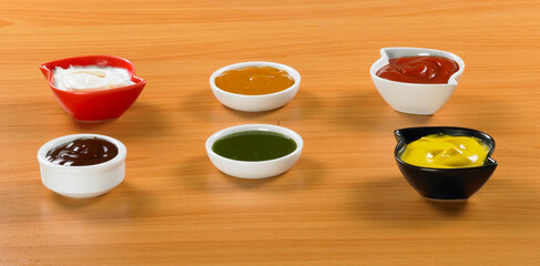 Bowl with sauce set isolated on white background