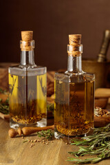 Bottles of olive oil with herbs and spices.