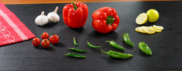 Vegetables and spices at wooden board