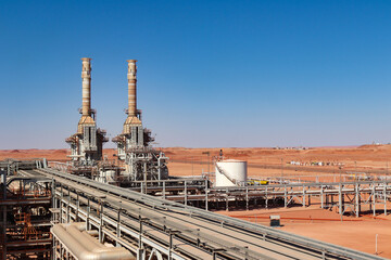 Hot oil heaters in oil & gas industry with blue sky and sand in desert 