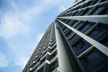 Fototapeta premium low angle view of singapore city buildings against bluee sky 