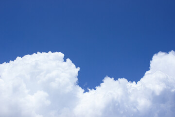 Blue sky and white fluffy clouds, free copy space for text. Baground