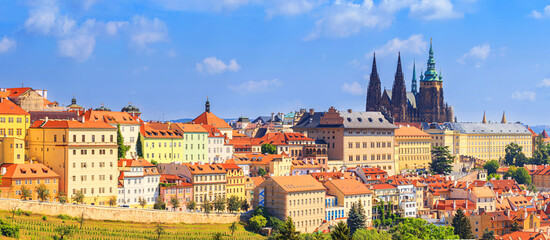 Naklejka na ściany i meble Summer cityscape, panorama, banner - view of the Hradcany historical district of Prague and castle complex Prague Castle, Czech Republic