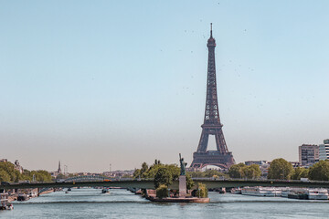 The statue of liberty and the Eiffel Tower in Paris. 
