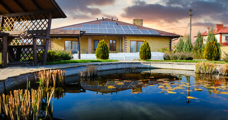 Residential solar installation with black solar panels. Low profile photovoltaic system on suburban...