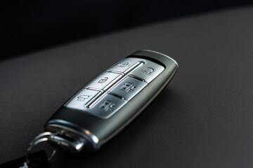 Obraz premium Close up of a modern wireless car key. Modern car interior..