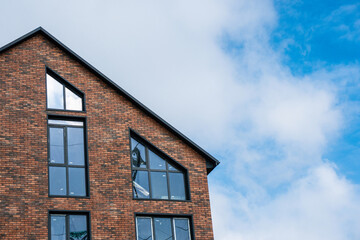 Fototapeta na wymiar A beautiful brick building with large windows