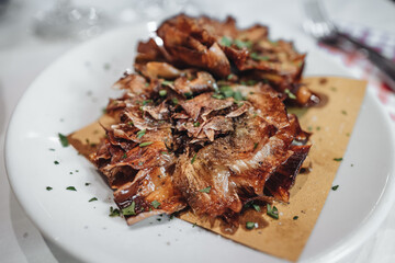 Carciofi alla romana, a traditional roman dish, fried artichokes