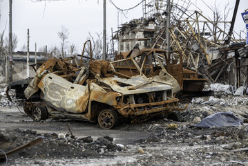 burnt cars and destroyed buildings of the workshop of the Azovstal plant in Mariupol