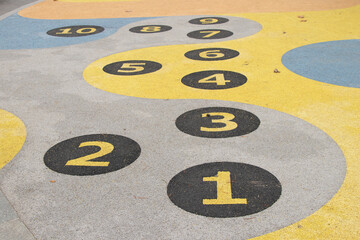 Children's game with numbers in circles on the playground on the roads for jumping in Ukraine, playground, game