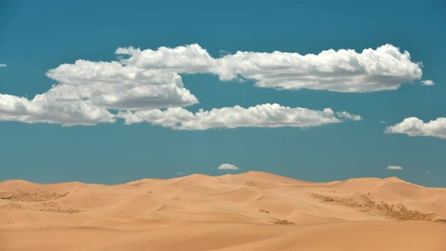 Timelapse video of sand dunes of Gobi desert and flying clouds