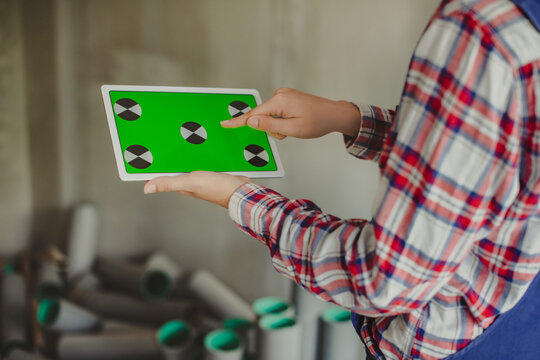 Woman Construction Manager Using Tablet Device With Green Screen And Touch Screen With Finger. Architect Or Designer