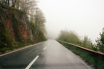 road in the mountains in rainy and foggy weather
