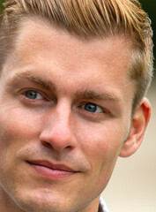 close-up of a handsome young blond man