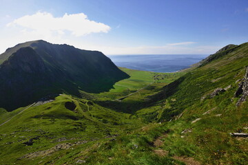 Unstad and the Atlantic from Saupstadtinden (550m) with fish stock drying racks (centre left),...