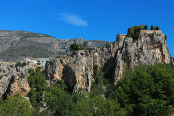 Fototapeta na wymiar Guadalest castle on the topmost part of the cliff with castle buildings