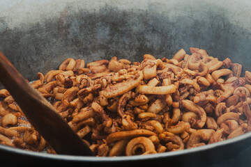 Frying pork greaves on traditional way in Croatia