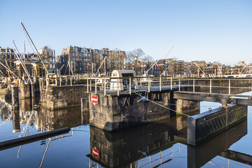 Amstel locks originally built in 1673, after canal belt had its fourth expansion. Amstel locks renovated in 19th century. Amsterdam, the Netherlands.