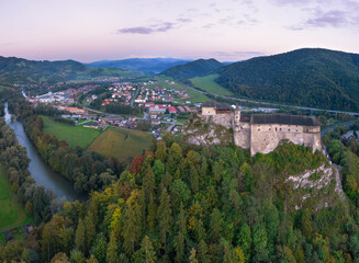 Fototapeta na wymiar Old castle on a hilltop backdropped by a village