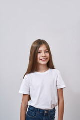 Obraz premium Cute smiling caucasian little girl look at camera