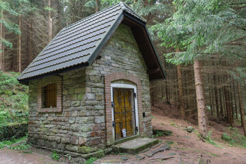 Fototapeta na wymiar Forest chapel near spring called Good Water in Jesenik mountains.
