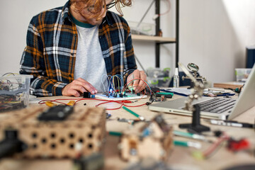 Man engineer do scientific experiment in workplace