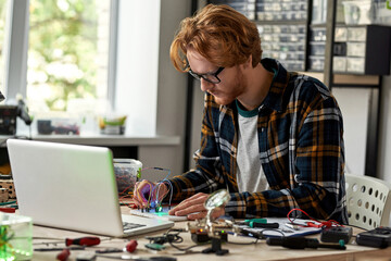 Technician or engineer connecting wires and cables