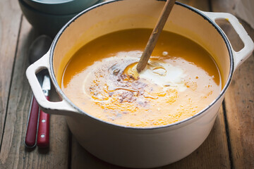 Creamy pumpkin soup with seasoning  and cream