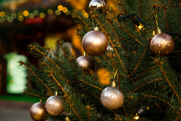 Obraz na płótnie Canvas Beautiful,festive toys on the Christmas tree on New Year's Eve,close-up