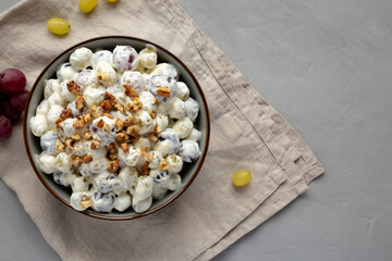 Healthy Creamy Grape Salad in a Bowl, top view. Flat lay, overhead, from above. Copy space.