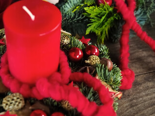 New Advent wreath with real red candles and Christmas decorations