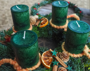 New Advent wreath with real green candles and Christmas decorations