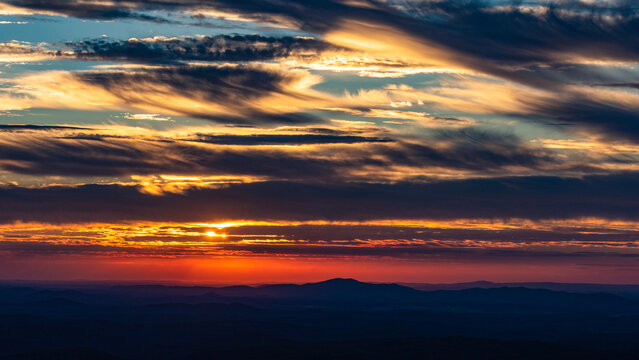 Sunset Peaking Through Clouds